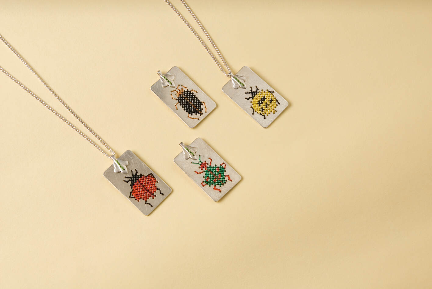 Caro Bärtling_embroidered necklace-four shiny beetles